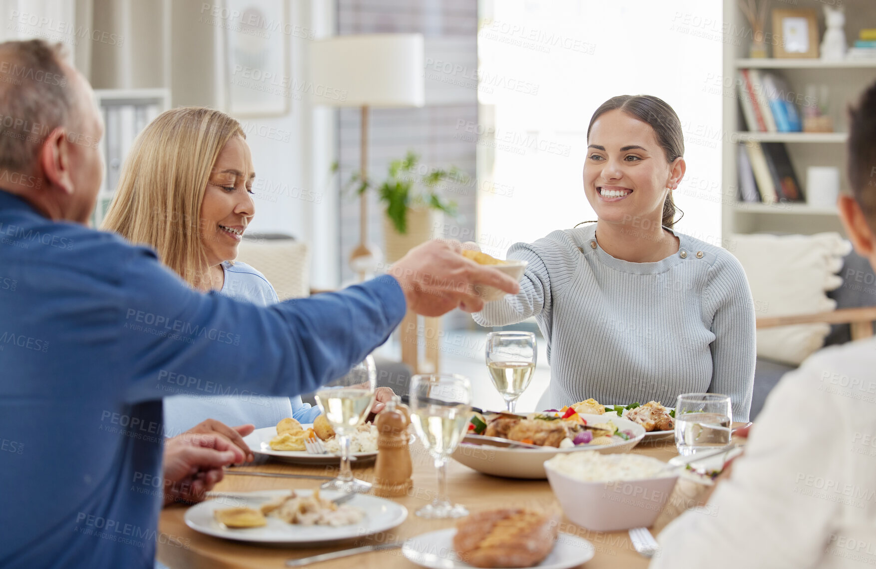 Buy stock photo Help, smile and food with family at dining room for Thanksgiving celebration, festive holiday and brunch. Support, love and party with people and dinner for nutrition, grateful and tradition at home