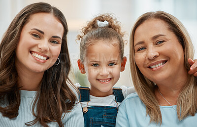 Buy stock photo Shot of a young woman and her mother spending time with her daughter