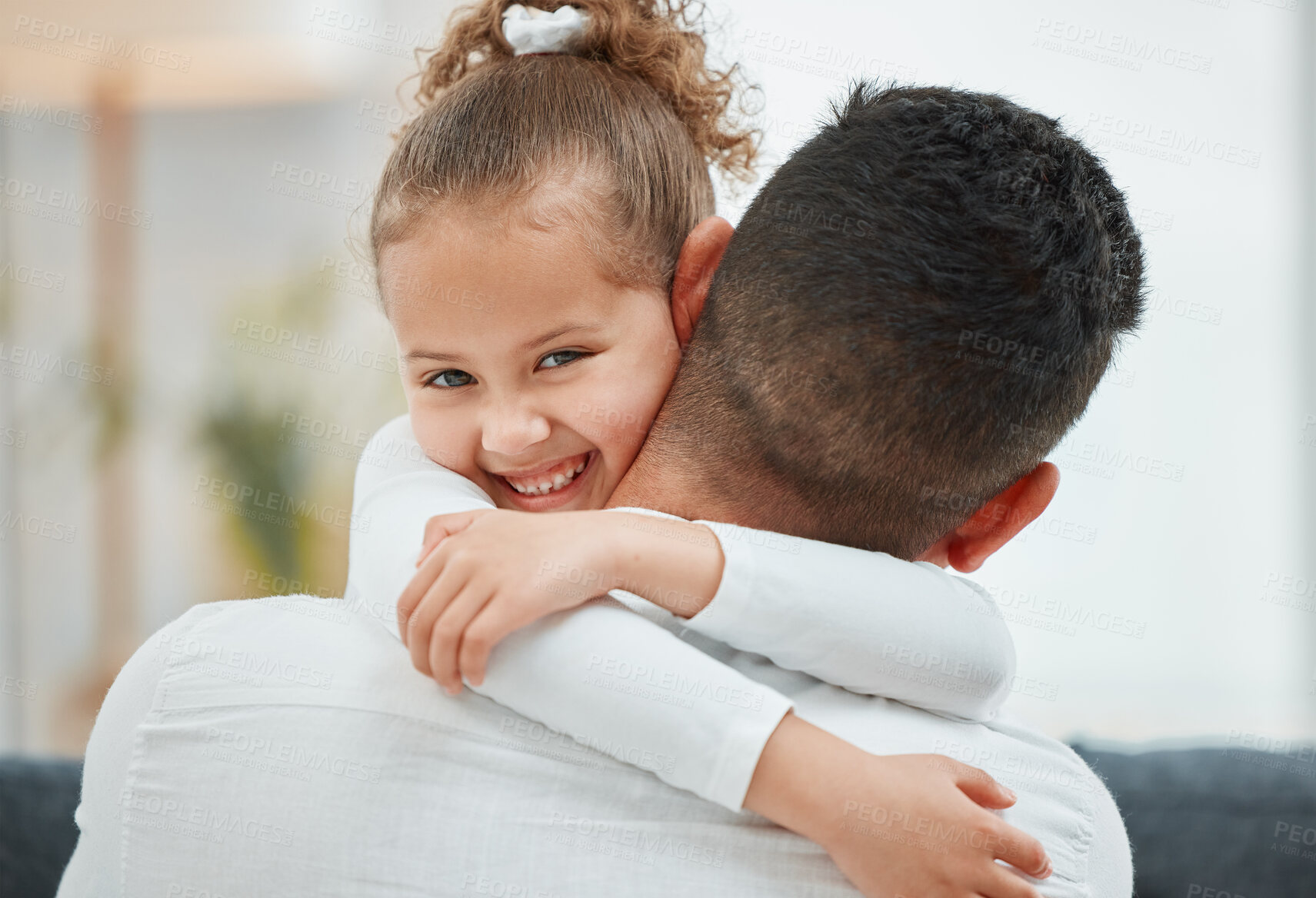 Buy stock photo Shot of a little girl being held by her father