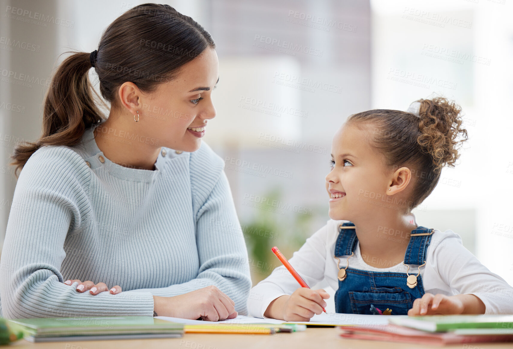 Buy stock photo Woman, kid and notebook in home for education, support and helping with homework. Mother, happy girl or encourage in living room for learning, creative or development with appreciation for assistance