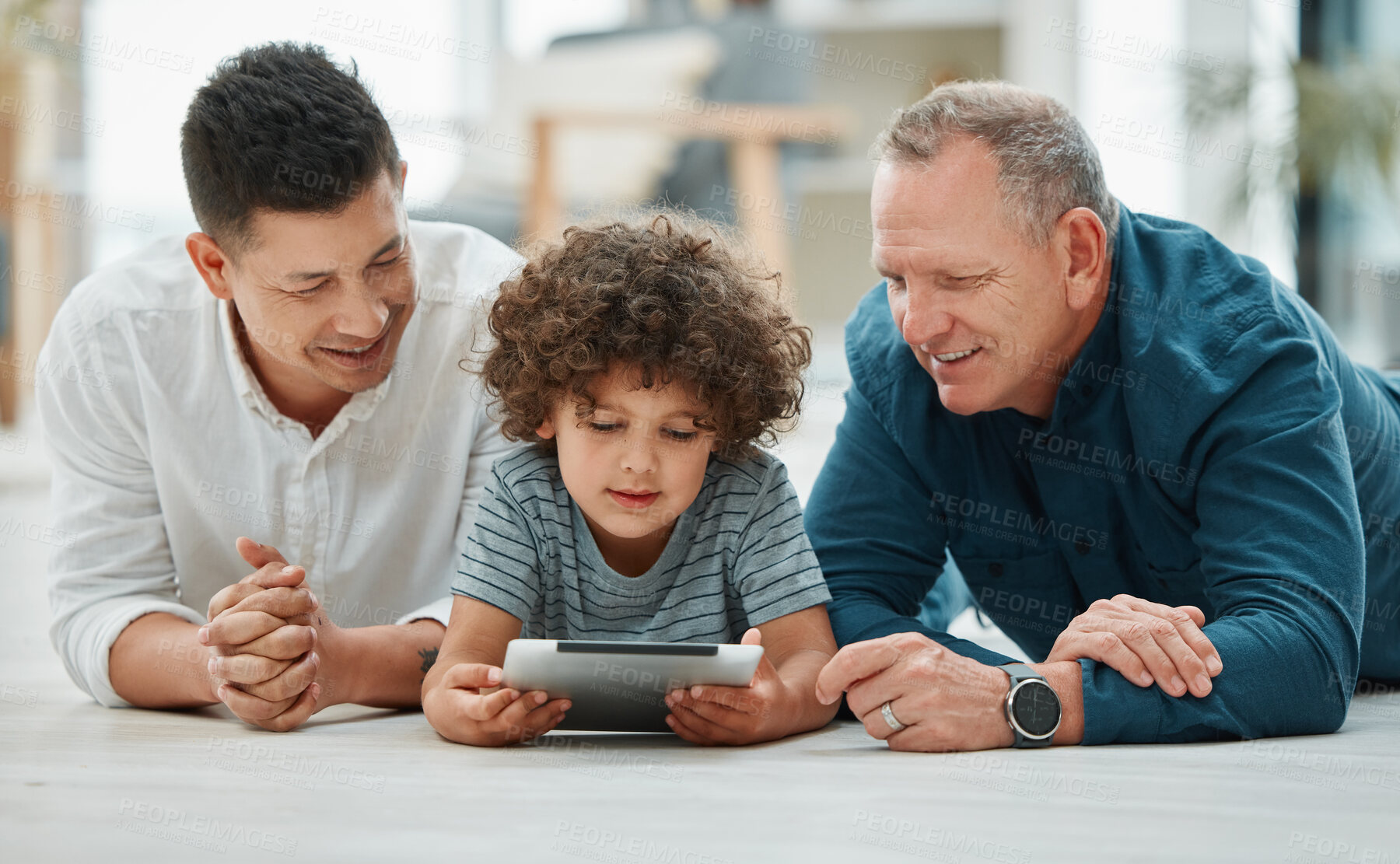 Buy stock photo Living room, child and grandfather with dad, tablet and bonding of family, floor and watching video. Elearning, growth and development of boy, online and reading of ebook, old man and father in house