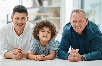 Buy stock photo Shot of a young man spending time with his father and son
