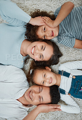Buy stock photo Shot of a young family together at home