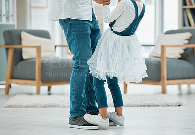 Buy stock photo Legs, house and father with girl, dancing and energy with happiness, love and bonding together. Apartment, family and dad with daughter, parent and playing with fun, carefree and cheerful in lounge