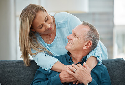 Buy stock photo Shot of a mature couple lovingly looking at one another
