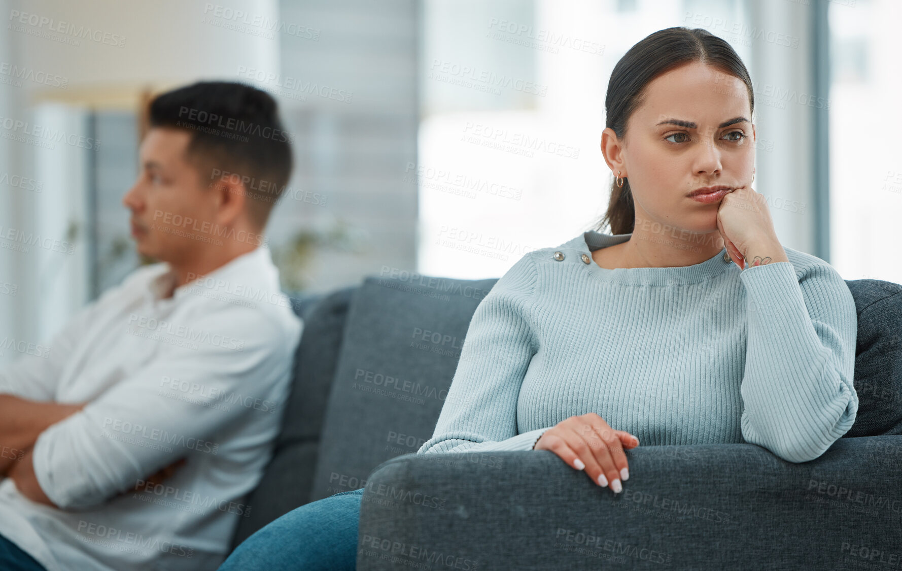 Buy stock photo Fighting, ignore and couple with argument, stress and depression with tension in living room. Apartment, house and man with woman on couch, frustrated and angry with emotions, conflict and divorce