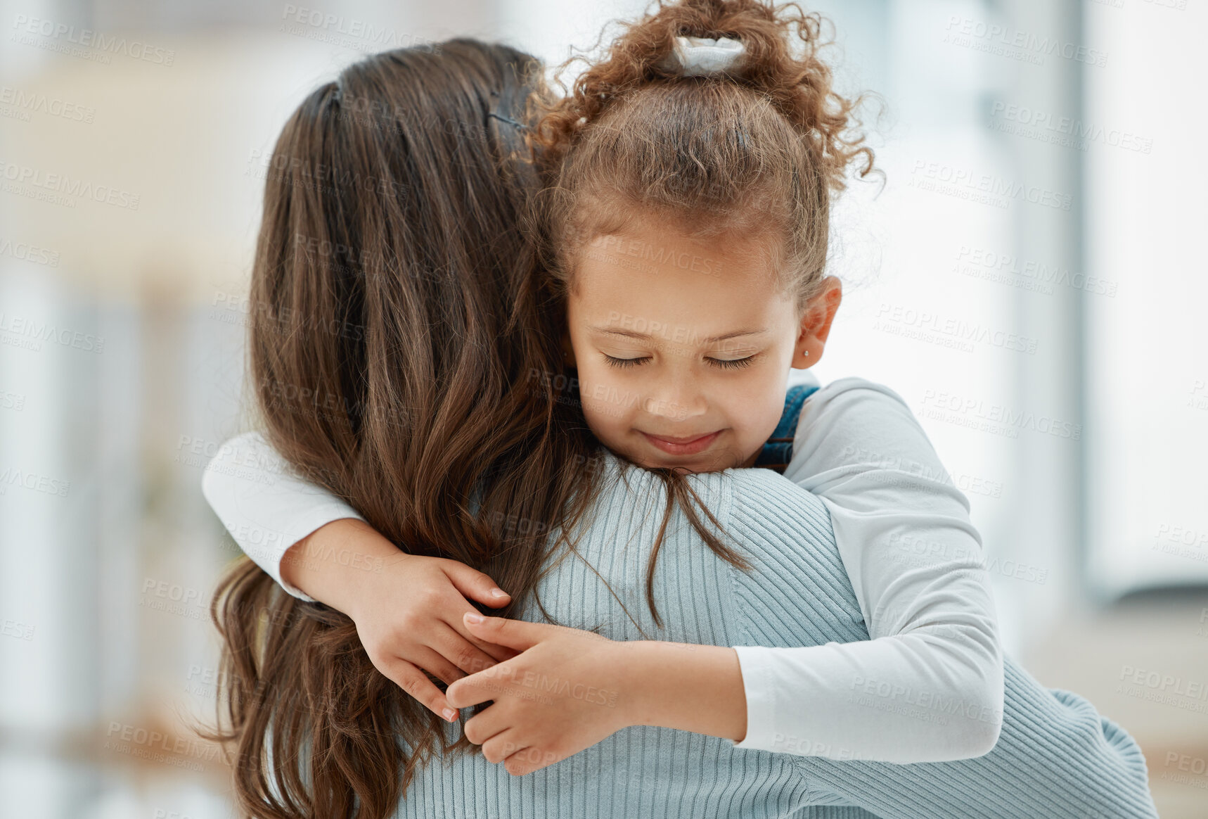 Buy stock photo Child, love and back of mom for hug, peace and happy for security and protection in home. Young girl, mother and embrace in living room for trust, comfort and pleased for parent return on weekend