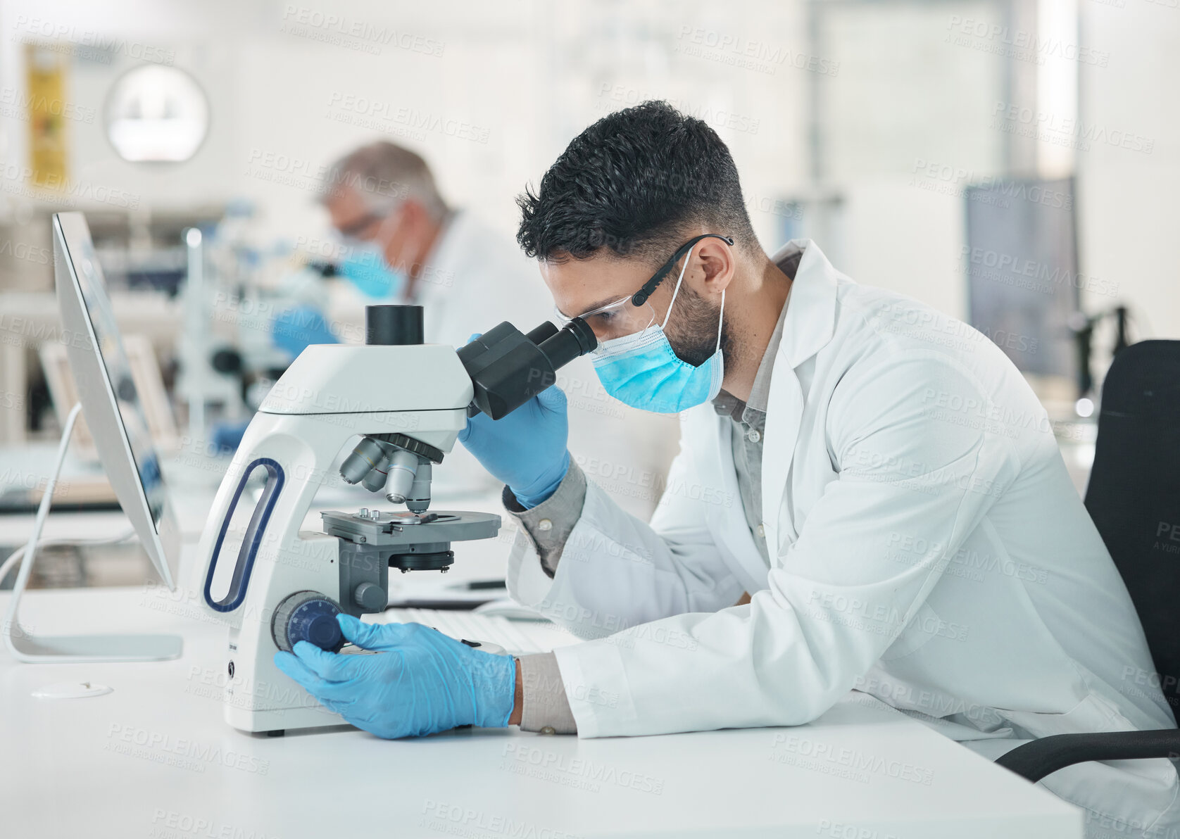 Buy stock photo Man, scientist and medical research with mask, microscope and science lab in experiment. Male person, innovation and pathology test for results, analysis or mpox vaccine in hospital or pharmaceutical