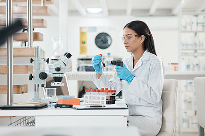 Buy stock photo Shot of a young scientist using a barcode reader while working with samples in a lab