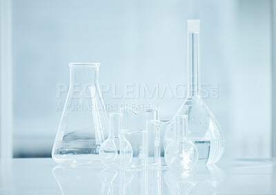 Buy stock photo Shot of a variety of glass beakers in a lab