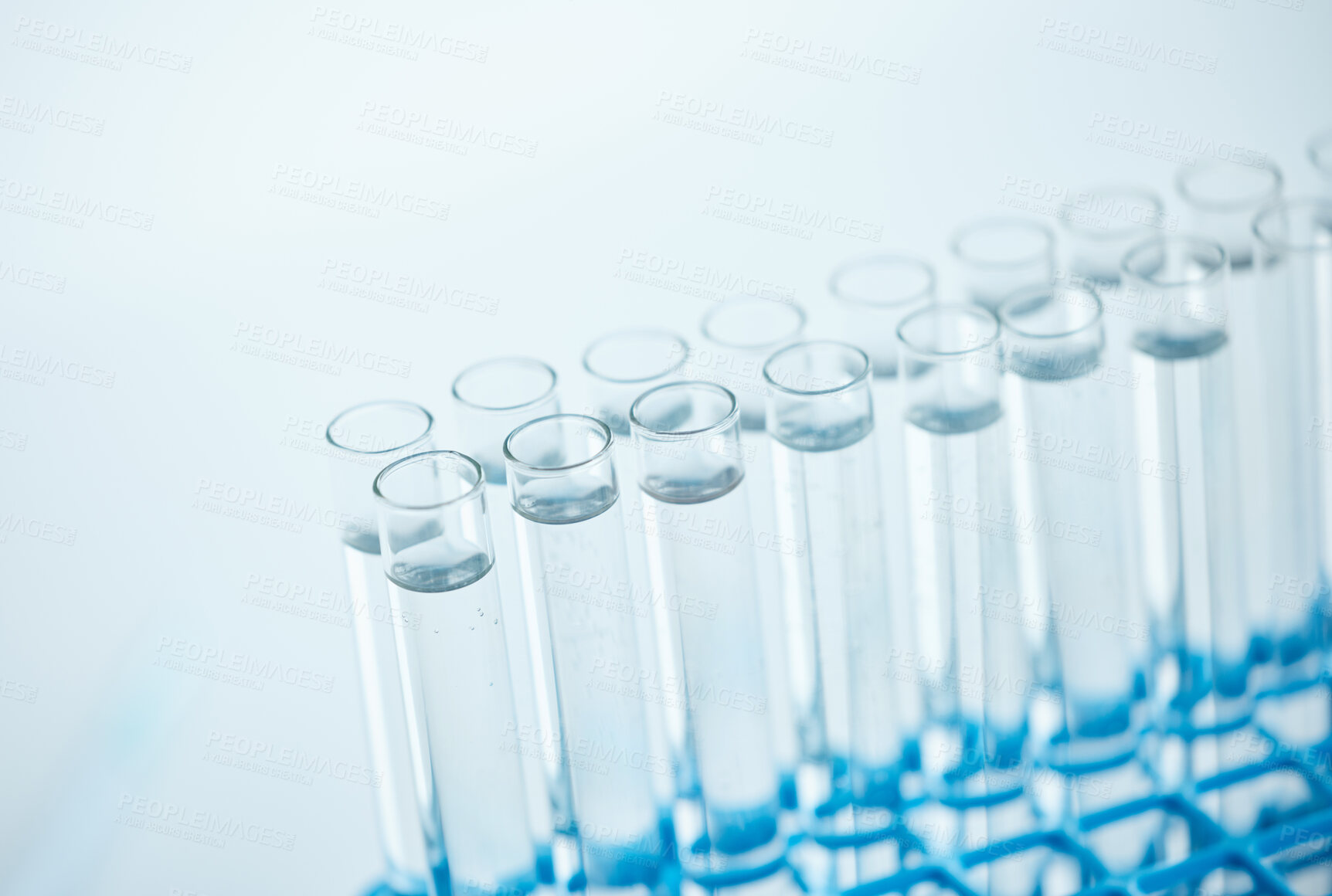 Buy stock photo Closeup shot of test tubes filled with liquid in a lab