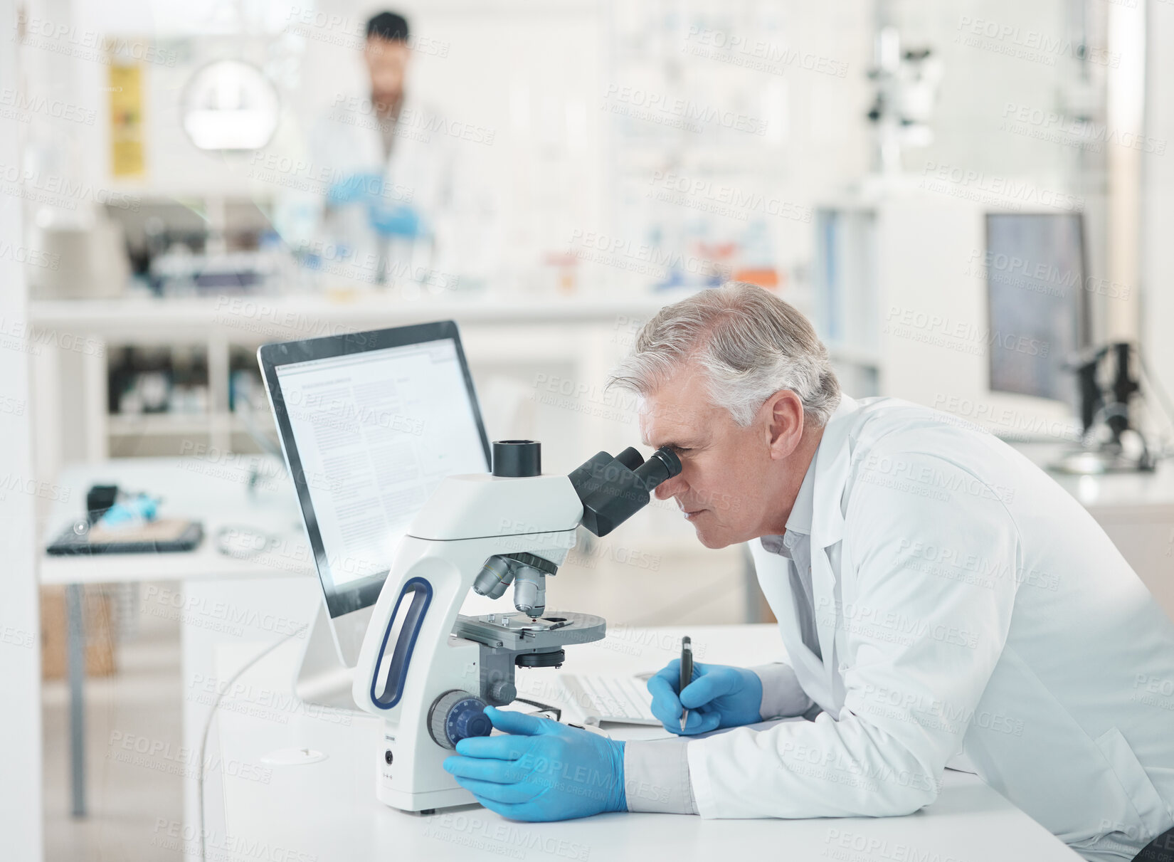 Buy stock photo Mature man, science experiment and medical research with microscope as scientist in lab. Male person, innovation and pathology test for results, analysis and mpox vaccine in clinic for pharmaceutical