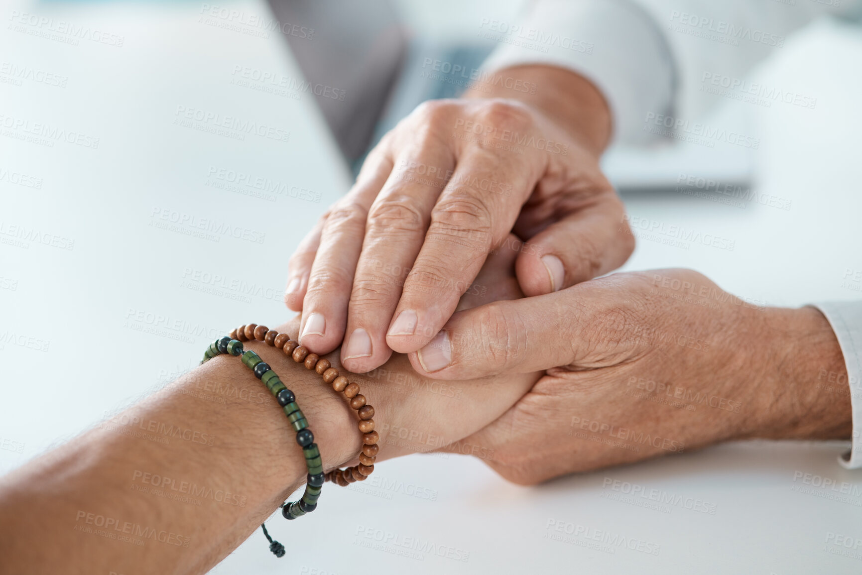 Buy stock photo Cropped shot of an unrecognisable doctor sitting and comforting his patient in his clinic during a consultation