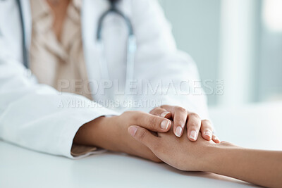 Buy stock photo Cropped shot of an unrecognisable doctor sitting and comforting her patient in her clinic during a consultation