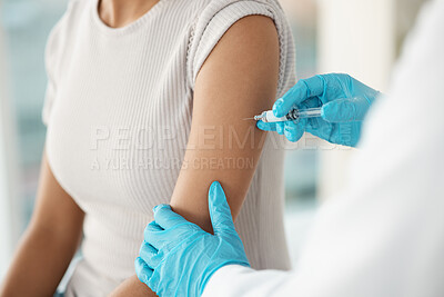 Buy stock photo Cropped shot of an unrecognisable doctor standing and injecting her patient during a consultation in the clinic