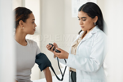 Buy stock photo Healthcare, blood pressure and doctor with a patient for a consultation in the hospital. Medicine, equipment and medical worker checking hypertension of a woman at a checkup in a medicare clinic.