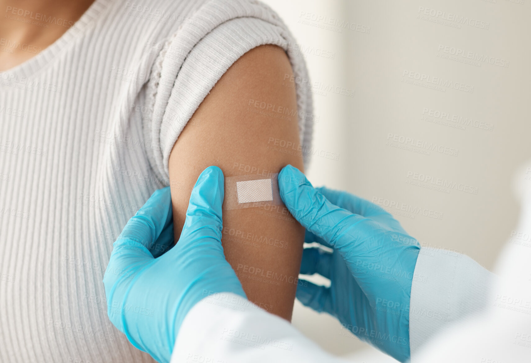 Buy stock photo Vaccine, person and hands of doctor with plaster for health, wellness and injection in clinic. Healthcare, patient or specialist in hospital for immune system strength, illness prevention or flu shot