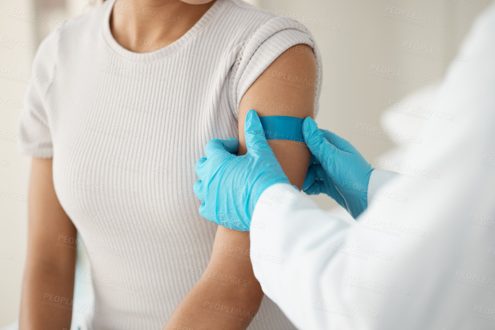 Buy stock photo Hands, doctor and patient with plaster at clinic for vaccine injection, medical safety and virus protection. People, checkup and wound for immune system, drugs treatment and mpox pharmaceutical 
