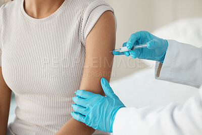 Buy stock photo Cropped shot of an unrecognisable doctor standing and injecting her patient during a consultation in the clinic