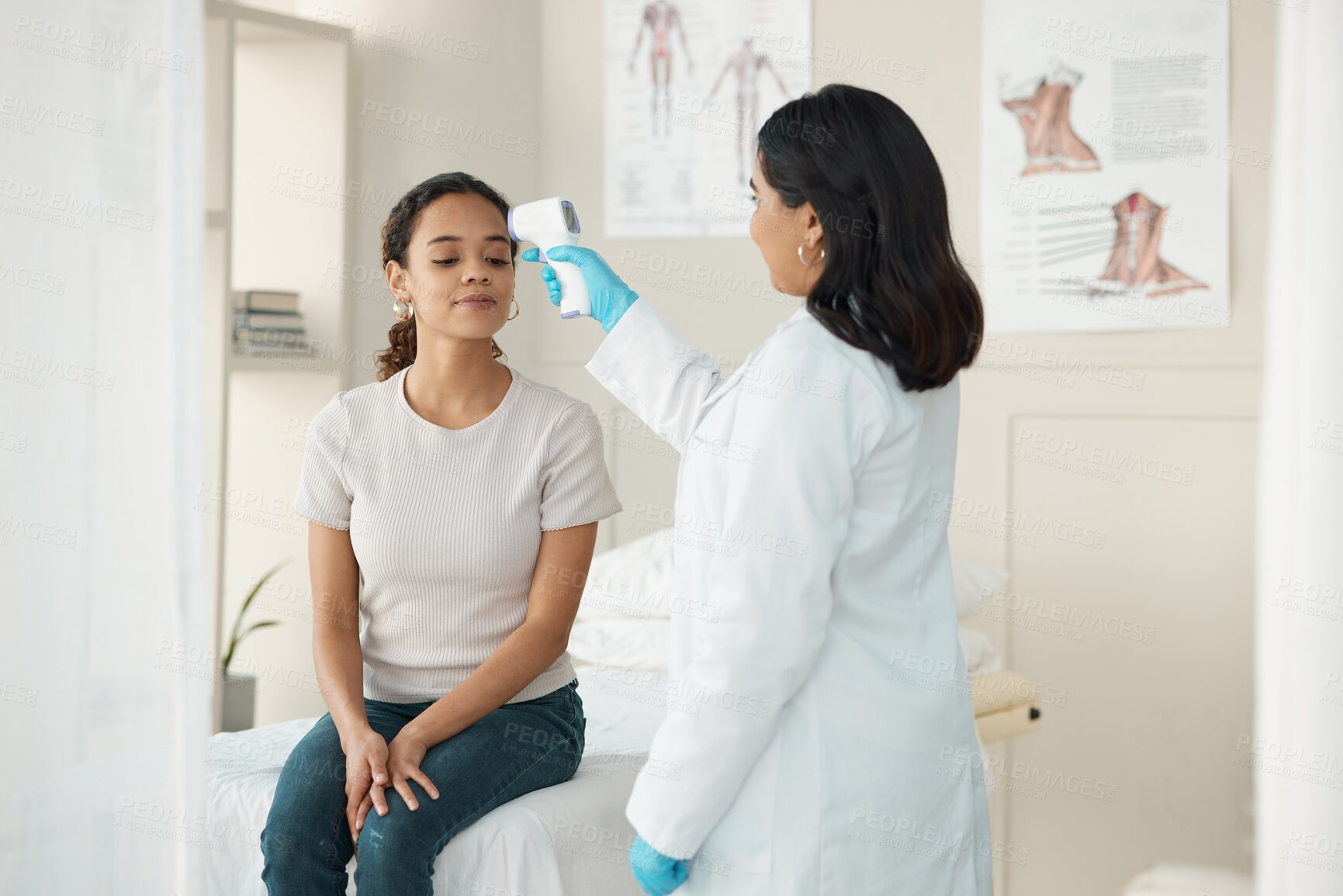 Buy stock photo Temperature, checkup and woman with doctor at clinic for flu, cold or allergies symptoms. Healthcare, consultation and medical worker with laser thermometer for female patient with fever in hospital.