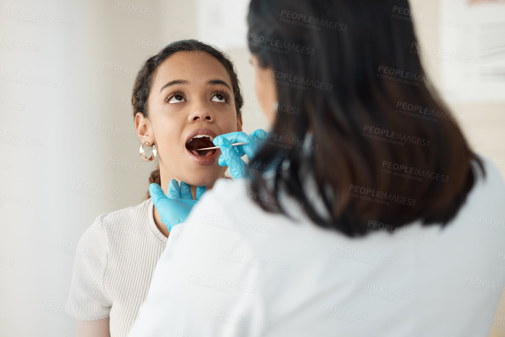 Buy stock photo Woman, doctor and mouth with gloves for checkup, examination or throat infection at hospital. Female person, medical worker or patient with tonsillitis, inflammation or swollen lymph nodes at clinic