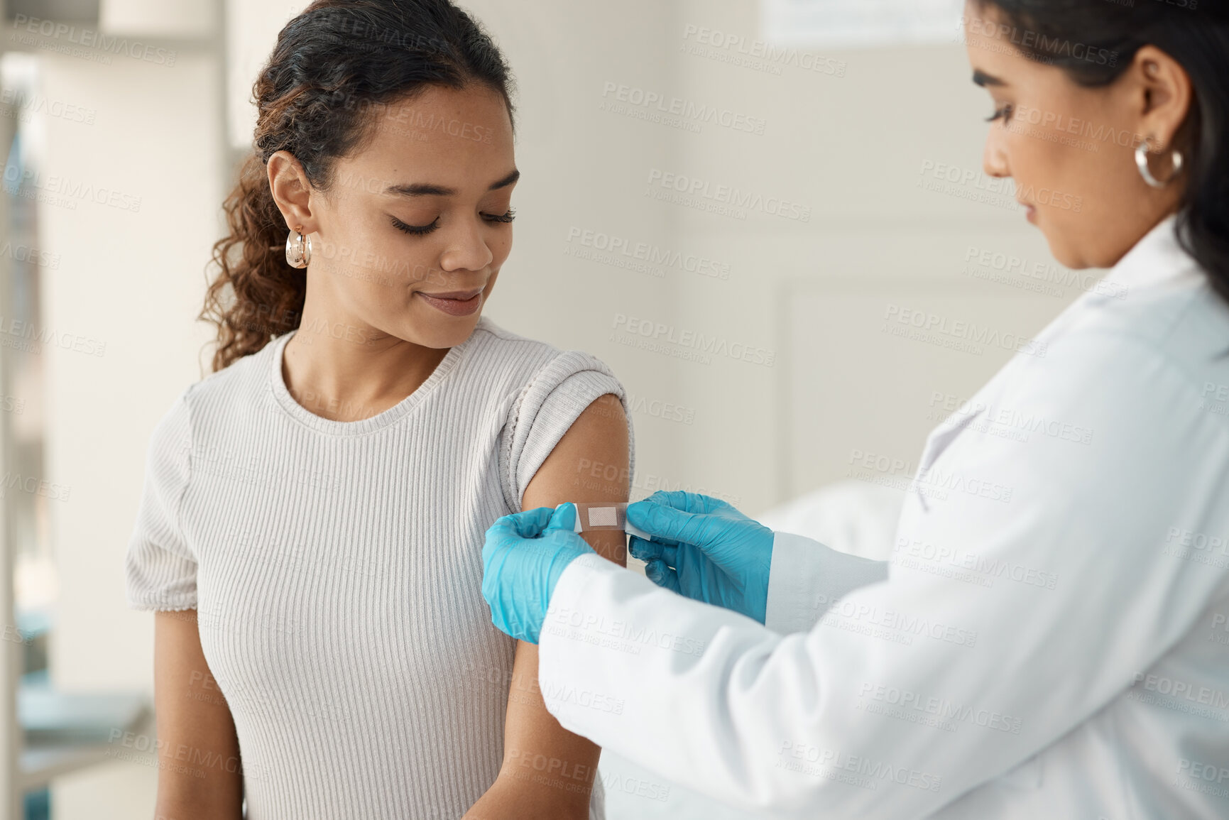 Buy stock photo Doctor, patient and plaster for vaccination at a clinic for health and wellness for virus. Healthcare, vaccine and patch at the hospital with cure for safety with medical results with medicine.