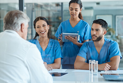 Buy stock photo Shot of a group of medical staff having a meeting