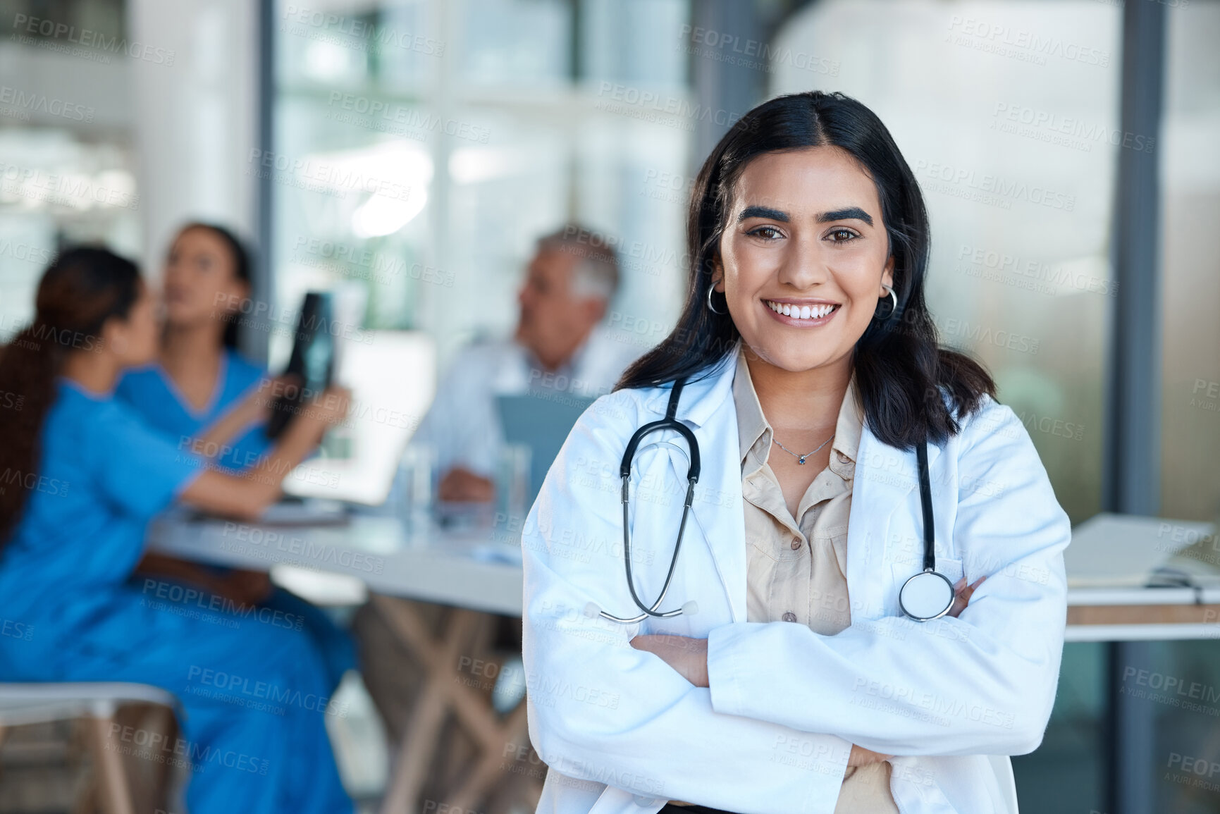 Buy stock photo Shot of a young female doctor during a meeting