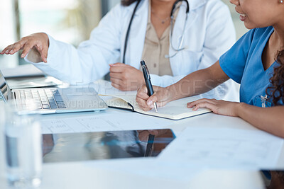 Buy stock photo Medical, meeting and writing hands with xray and doctor laptop with collaboration for diagnosis and surgery planning. Table, women and healthcare professional with notes, tech and working on research