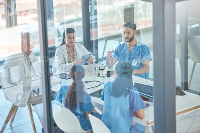 Buy stock photo Shot of a team of medical staff having a meeting