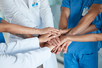 Buy stock photo Hospital, medical team and hands with huddle for teamwork, collaboration and coworking. Clinic, people and above for solidarity on synergy for success or achievement for surgery, motivation and unity