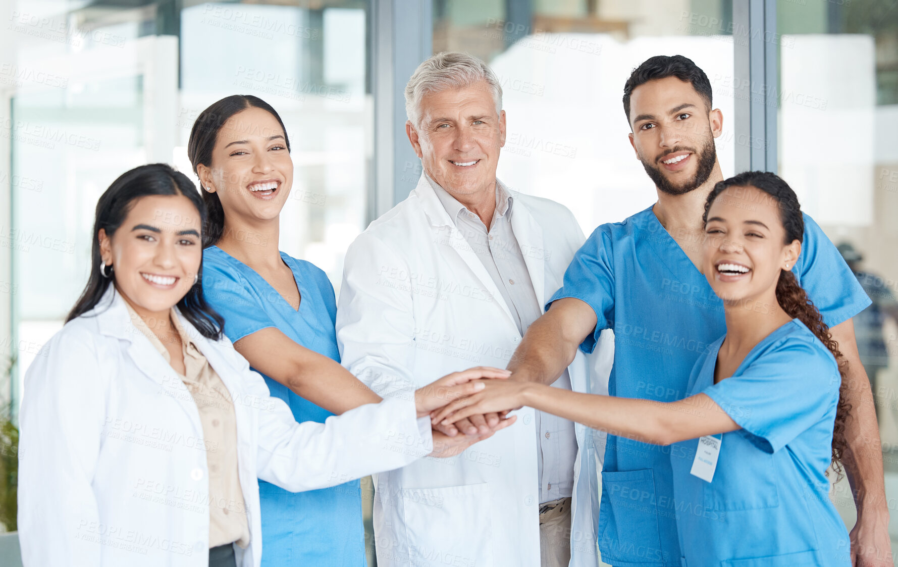 Buy stock photo Hospital, medical team and smile with huddle for teamwork, collaboration and synergy. Clinic, people and doctors or nurses on portrait with confidence for success, achievement and motivation or unity