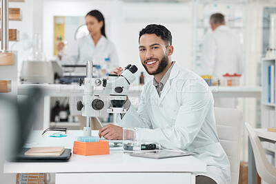 Buy stock photo Scientist, man and portrait by microscope in lab study, stats or smile for results with pride for research. Person, happy and excited for progress, pharmaceutical innovation or medicine in Costa Rica