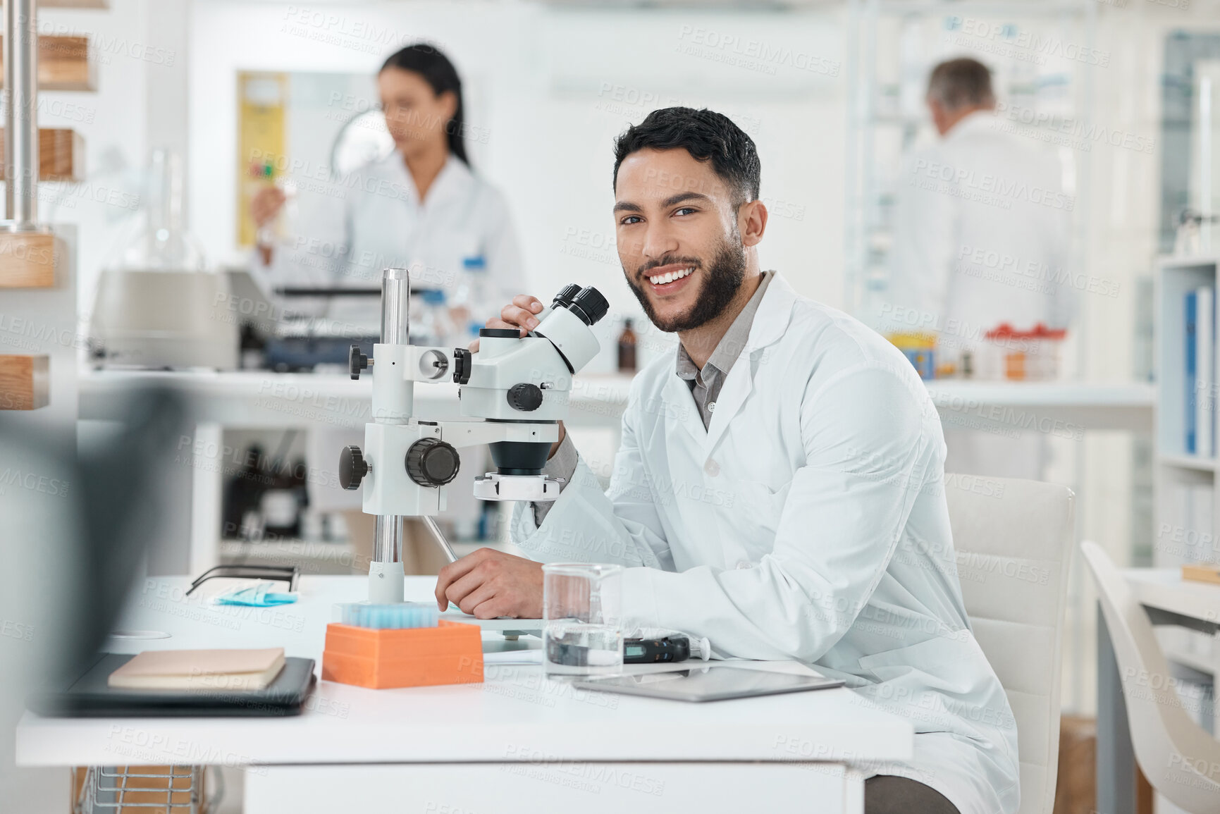 Buy stock photo Scientist, man and portrait by microscope in lab study, stats or smile for results with pride for research. Person, happy and excited for progress, pharmaceutical innovation or medicine in Costa Rica