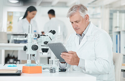 Buy stock photo Mature man, scientist and tablet in laboratory for reading, study and thinking for innovation with microscope. Person, digital touchscreen and review with pharmaceutical development for mpox vaccine