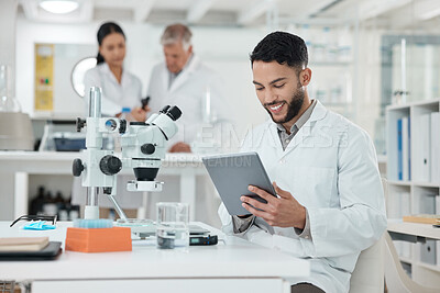 Buy stock photo Man, scientist and tablet in laboratory with reading, study or thinking for innovation by microscope. Person, digital touchscreen and smile for review with pharmaceutical development for mpox vaccine