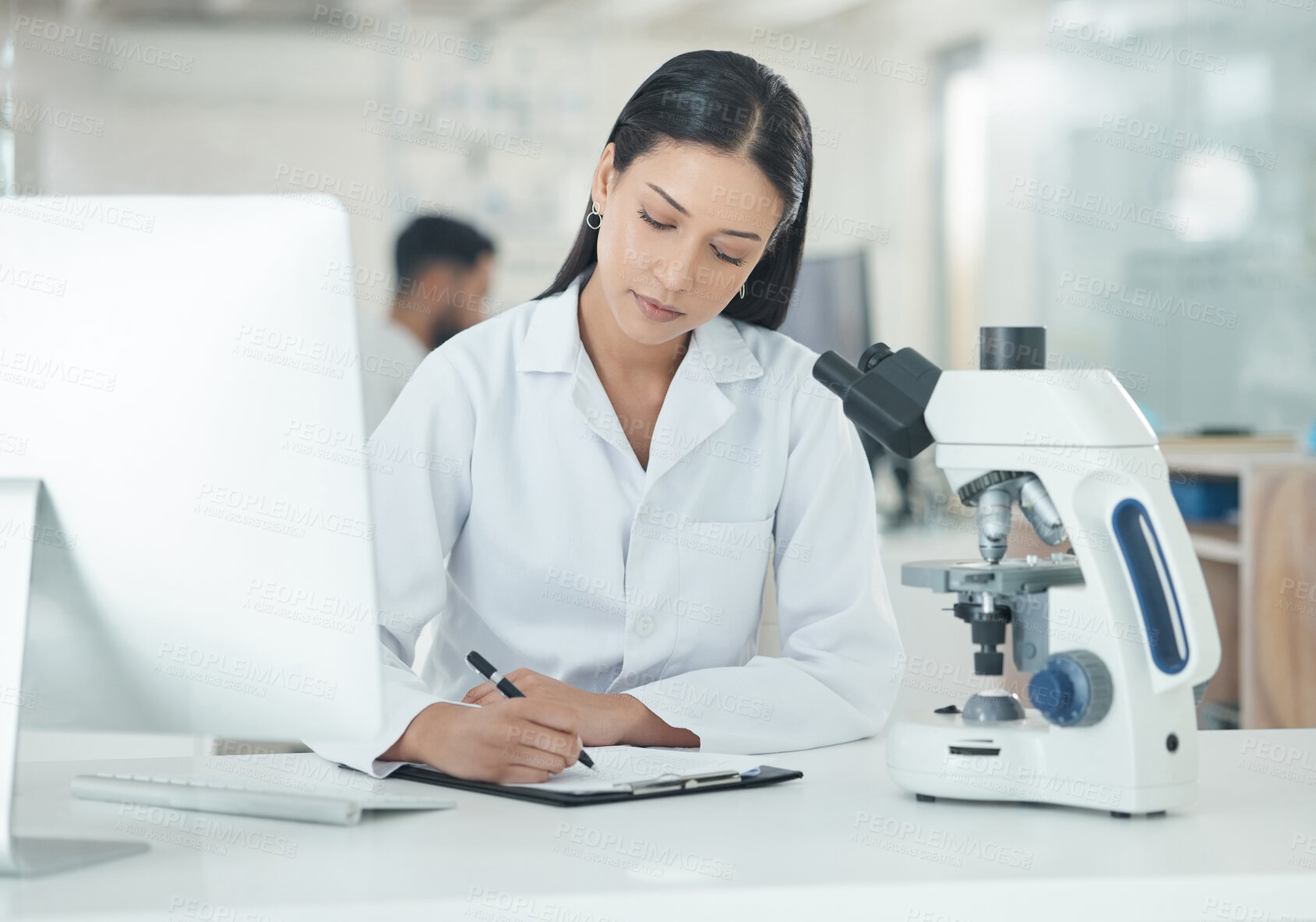 Buy stock photo Scientist, woman and notes from microscope research and medical analysis in clinic laboratory. Chemistry, paperwork and hospital document for monkeypox vaccine and science work with virus study