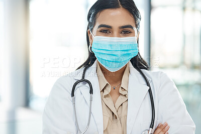 Buy stock photo Shot of a medical practitioner standing with her arms crossed in a hospital