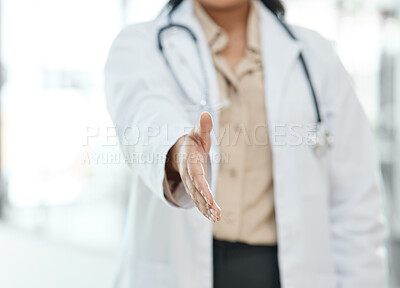 Buy stock photo Shot of unrecognizable female doctor gesturing a handshake in a hospital