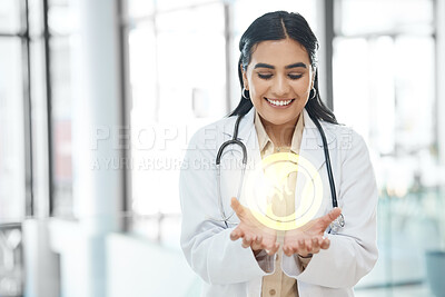 Buy stock photo Shot of a young doctor holding a image of a fetus in a hospital