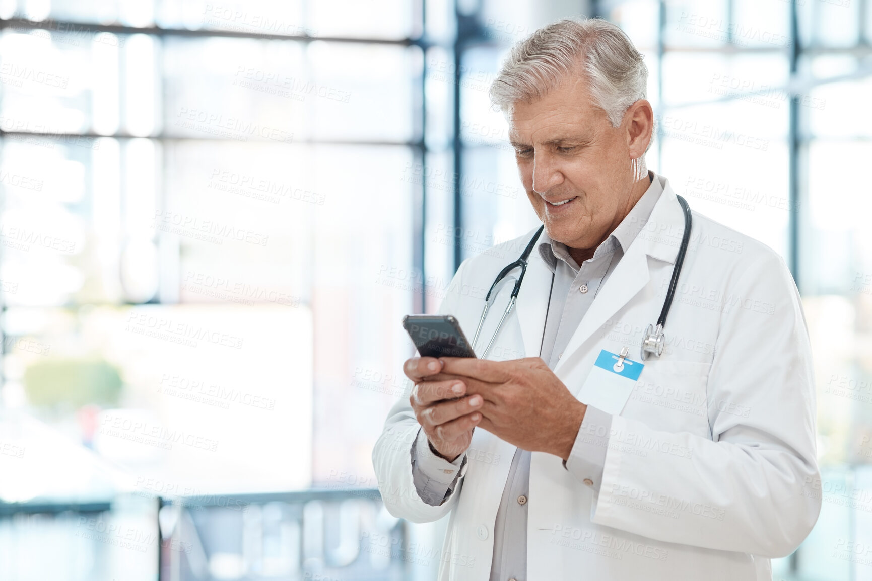 Buy stock photo Healthcare, mature man and doctor with cellphone, typing and internet with connection in hospital. Person, medical and professional with smartphone, app and research for diagnosis and online schedule