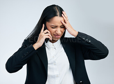 Buy stock photo Business woman, phone call and stress headache for difficult client, burnout and frustrated in studio. Lady, migraine pain and mobile chat with worry, mistake and work crisis by gray background