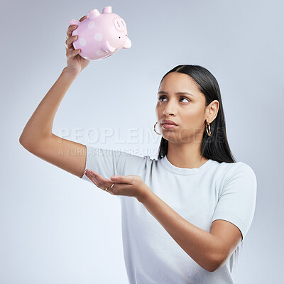 Buy stock photo Woman, studio and looking in empty piggy bank, financial crisis and budget failure with money container. Background, upset and female person or expense management issue, inflation and cost of living