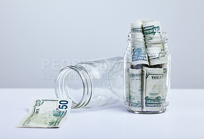 Buy stock photo Container, paper and cash as savings for financial freedom and investment with growth on white background. Glass jar, notes and money as budget for retirement, payment and dollar with finance