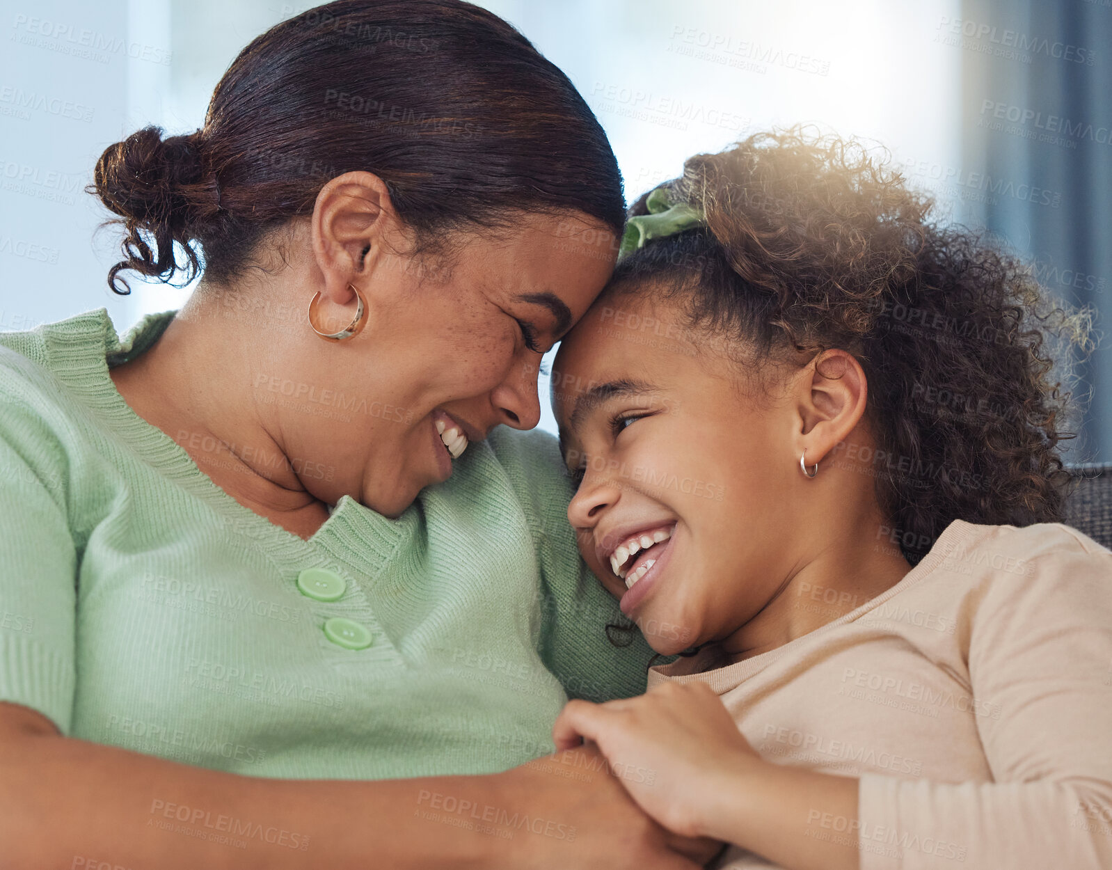 Buy stock photo Happy mother, daughter and relax with hug for love, care or embrace on sofa together at home. Mom, child or kid with smile for bonding, holiday or weekend in comfort, safety or protection at house