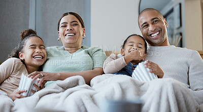 Buy stock photo Shot of a happy family eating popcorn while watching television together at home