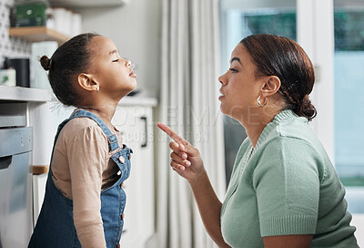 Buy stock photo Conflict, mom talking and frustrated girl in kitchen, home or conversation about trouble, mistake or problem. Mother, angry kid and discussion of discipline, behaviour or speaking together in house