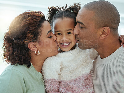 Buy stock photo Shot of an adorable little girl getting kisses on her cheeks from her parents