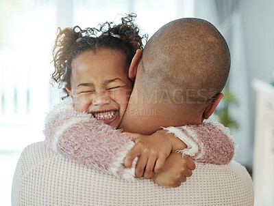 Buy stock photo Shot of an adorable little girl embracing her father