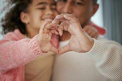 Buy stock photo Cropped shot of a little girl and her father forming a heart shape with their hands